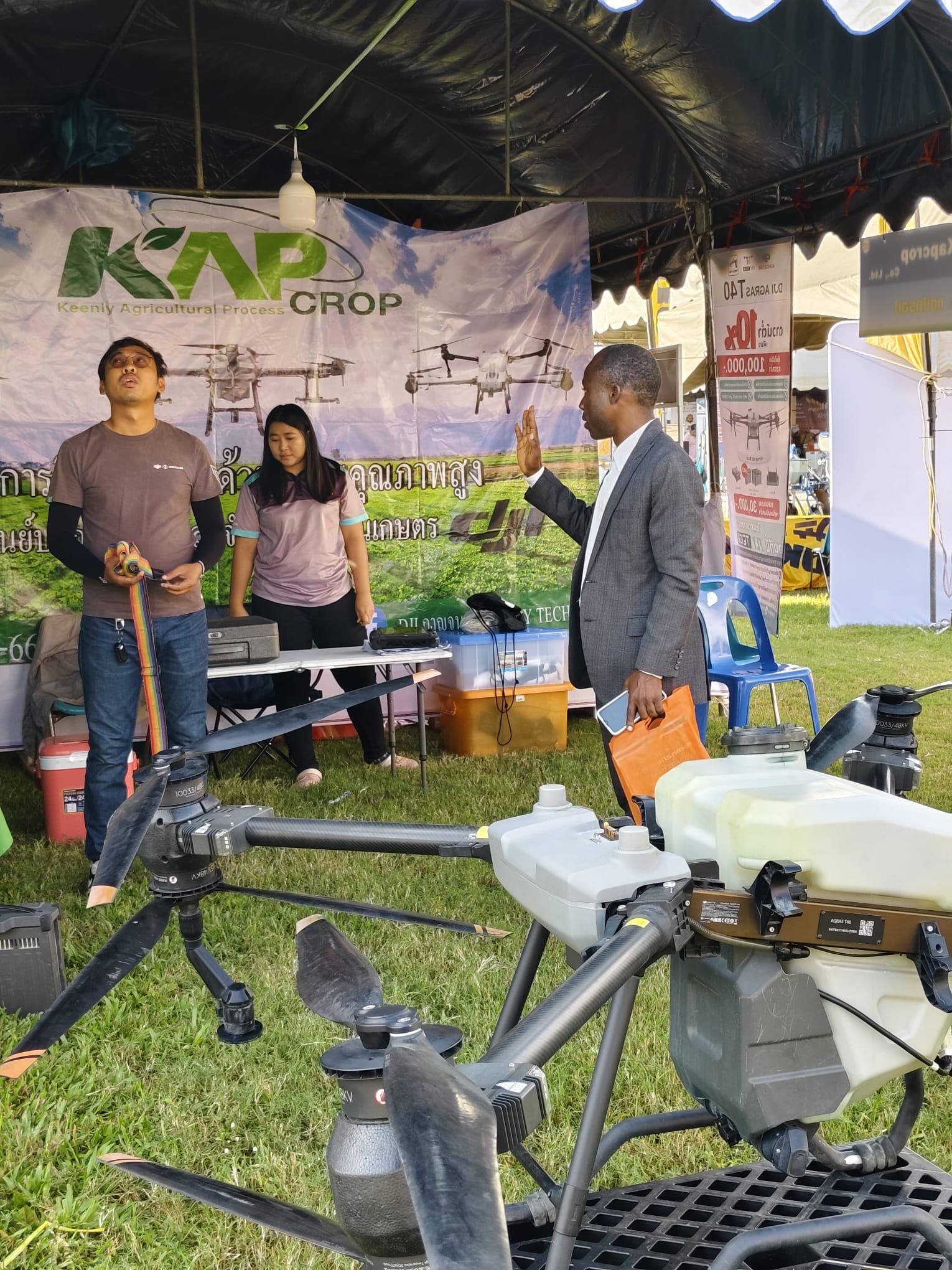 Discussion at an agricultural drone exhibition stand