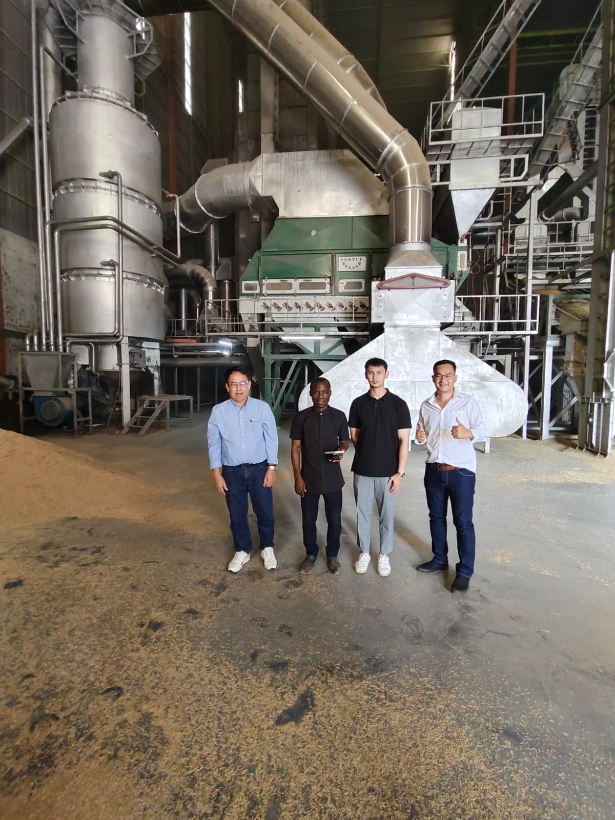Visiting delegation inside a large rice processing mill