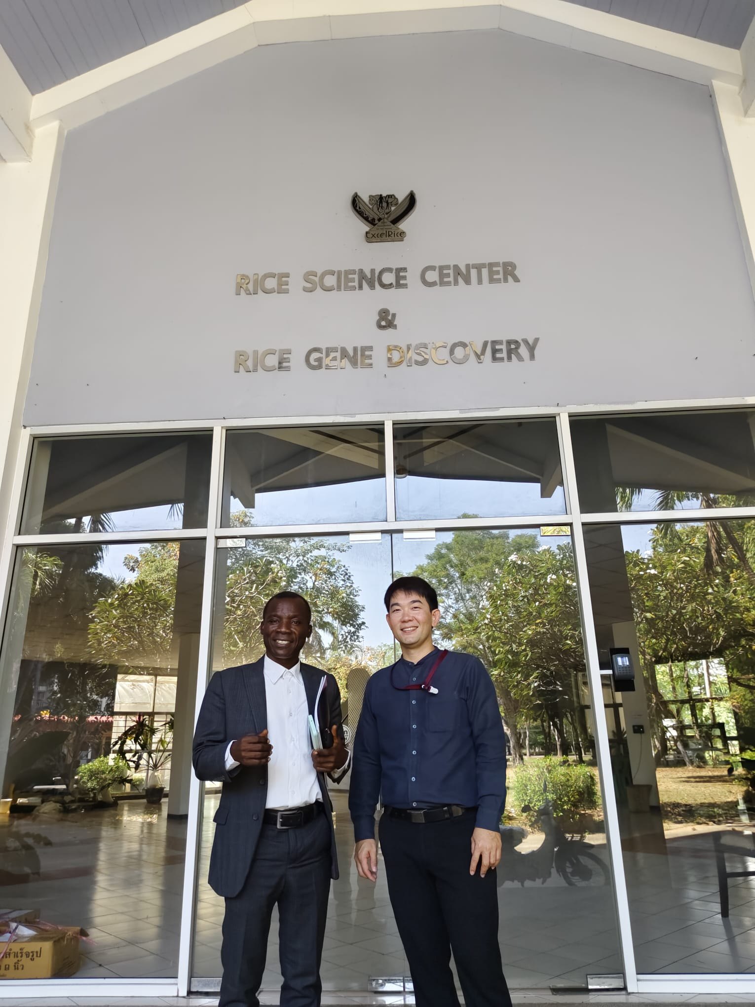 Visitors outside a rice science research centre